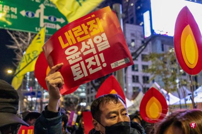 韩国执政党决定反对弹劾总统尹锡悦